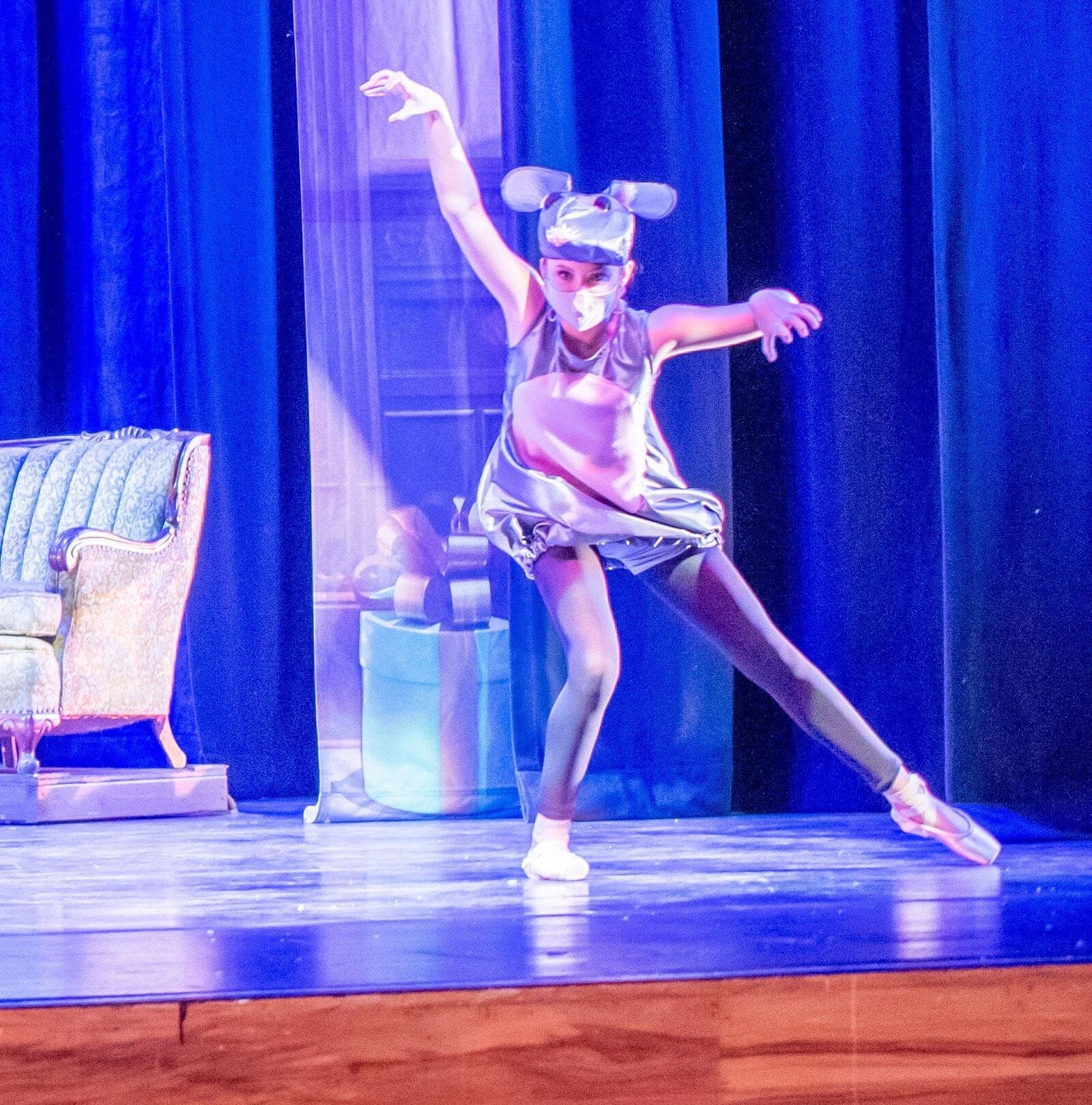 Person dancing in an animal costume.