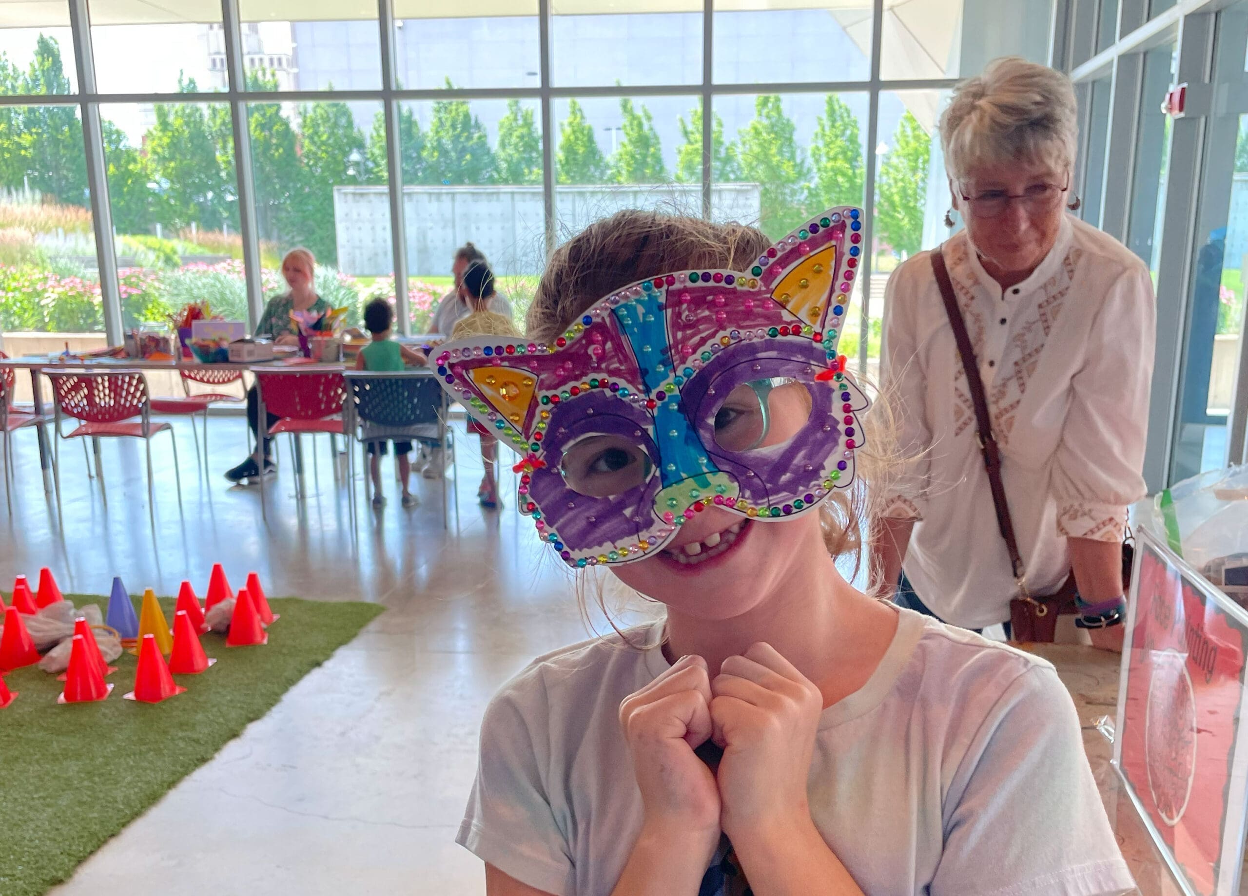 A child wearing a handmade mask.
