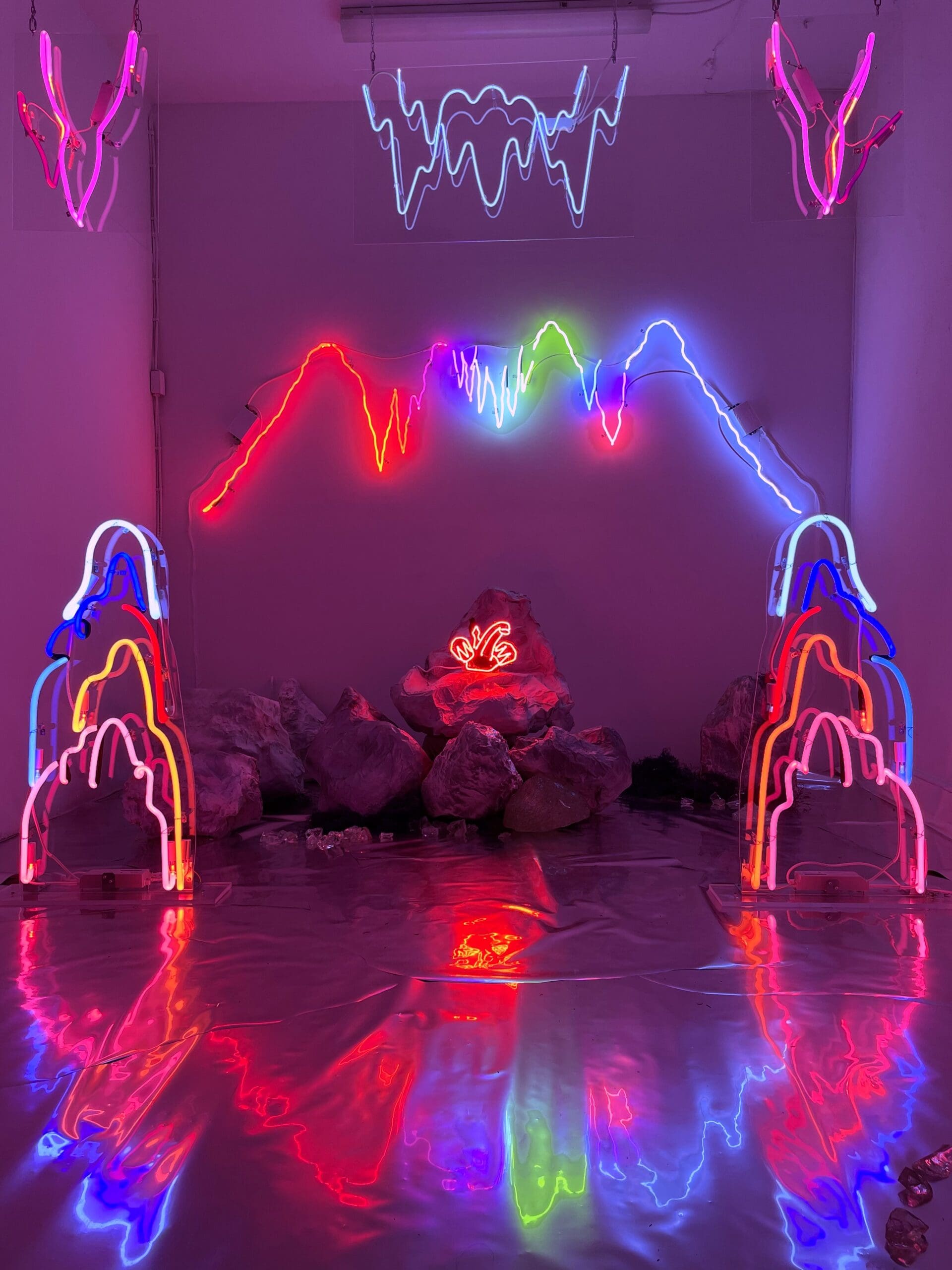 Alissa Eberle. Electric Caverns, 2021–24. Neon (Ne, Ar, Hg), glass, acrylic, Dibond, papier-mâché, horticultural flooring, glass slag. Courtesy of the artist