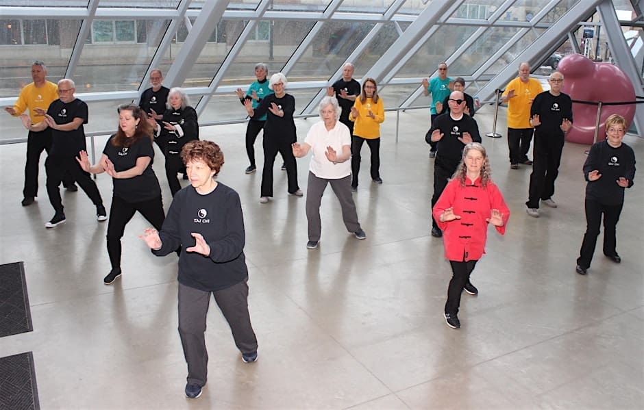 A group of people doing Tai Chi in the Museum.