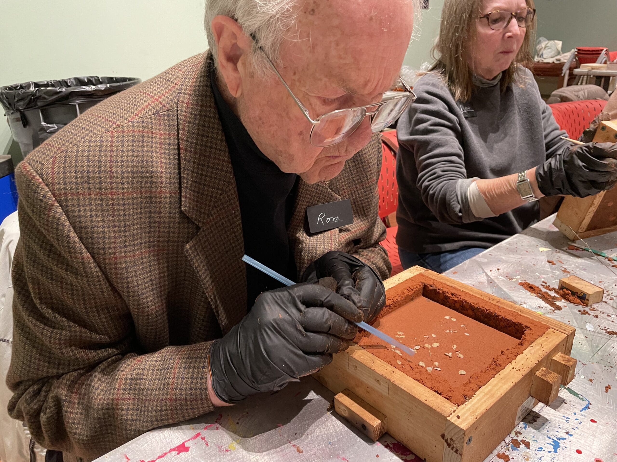 A man working on an art project.