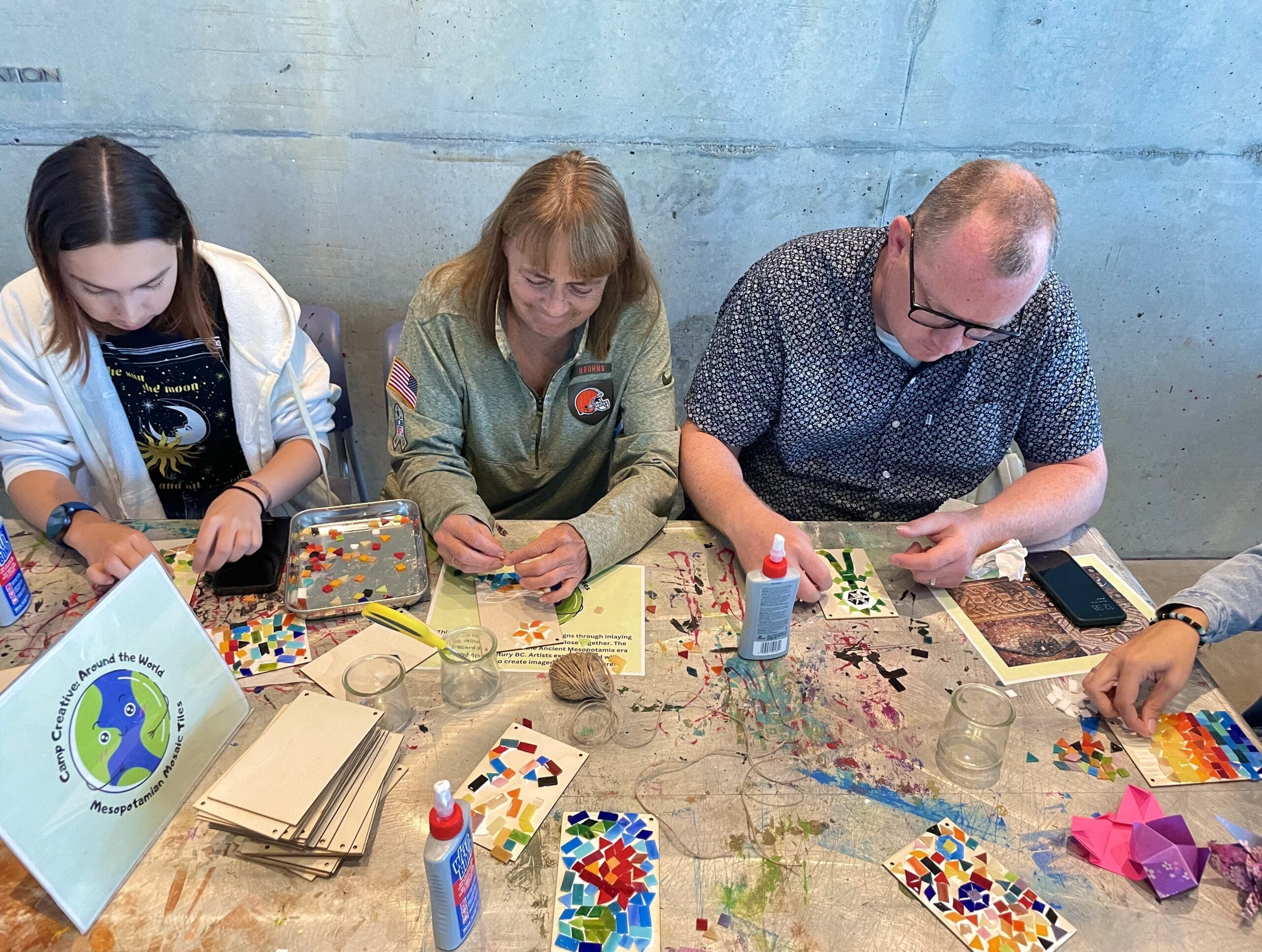 A group of people doing crafts at the Akron Art Museum