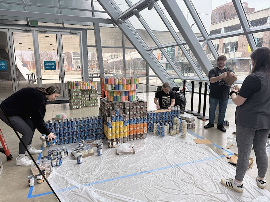 CANstruction, people building sculptures from cans of food in the Akron Art Museum lobby.