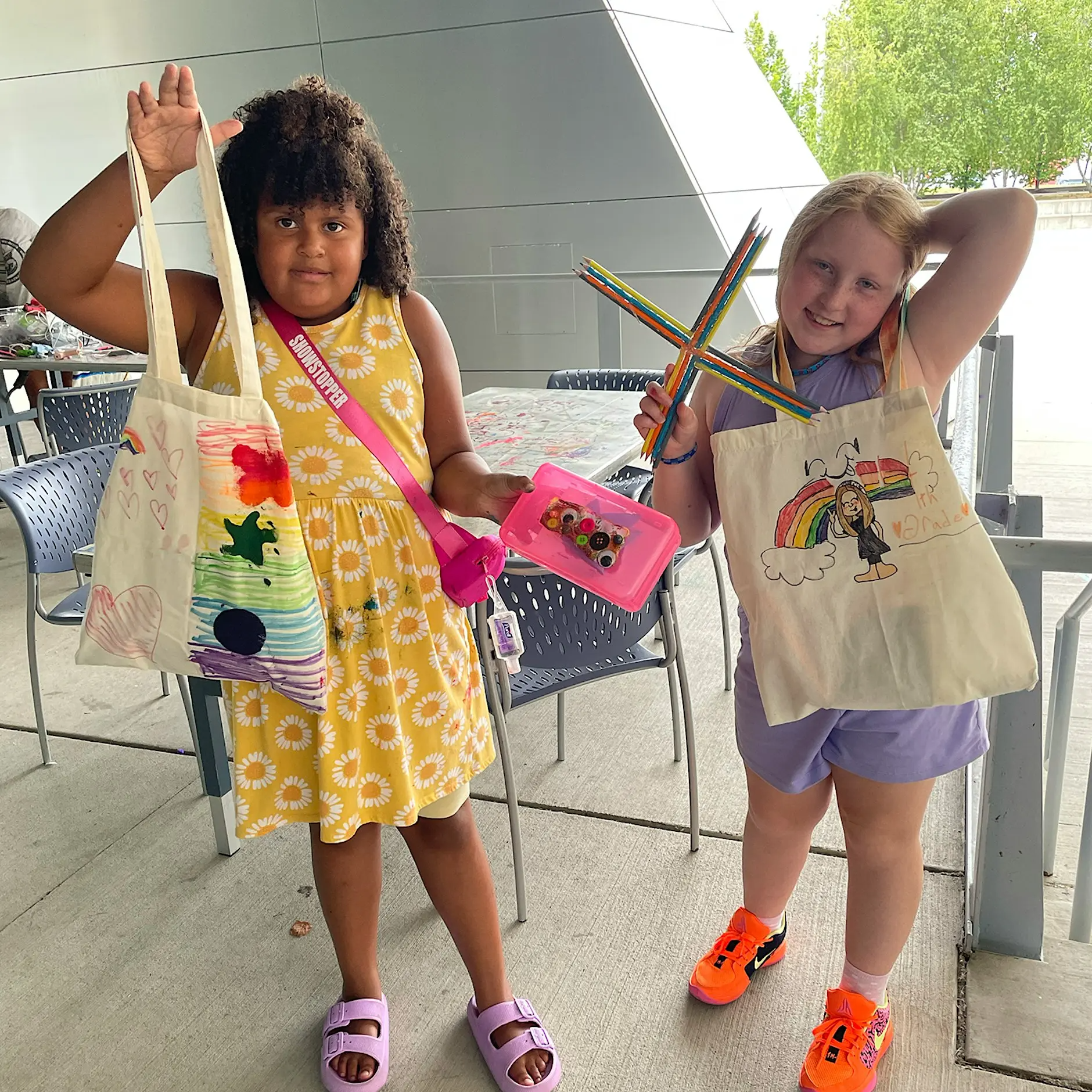 Two children making art projects at the Akron Art Museum.